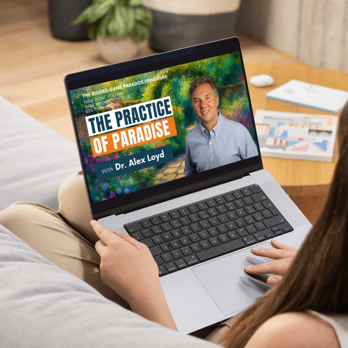 The Practice of Paradise with Dr. Alex Loyd on a laptop